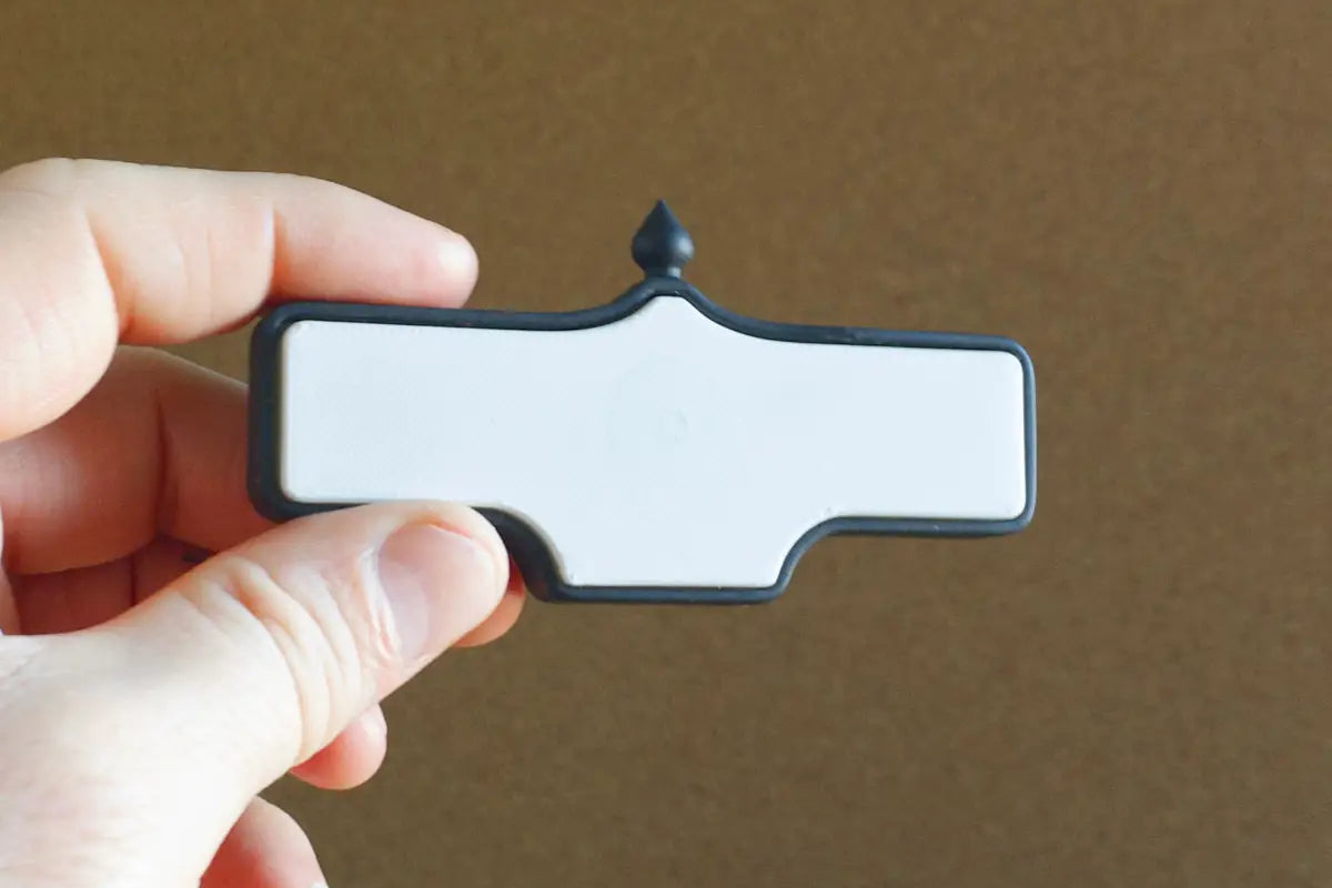 In-hand back view of Ardmore Rd. #24 Magnet - Weathered Finish, miniature replica Toronto Forest Hill acorn street sign
