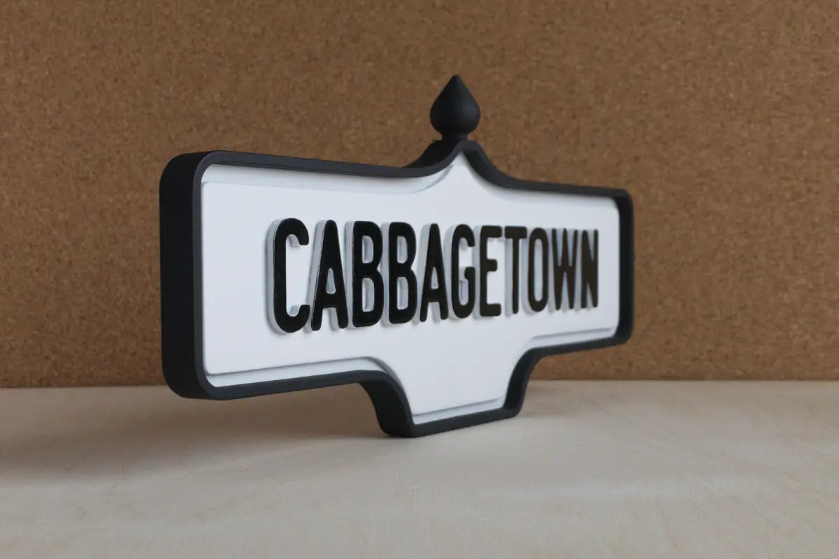 Angled front view of Cabbagetown Wall Sign - Standard Finish, wall-mounted replica Toronto acorn neighbourhood sign