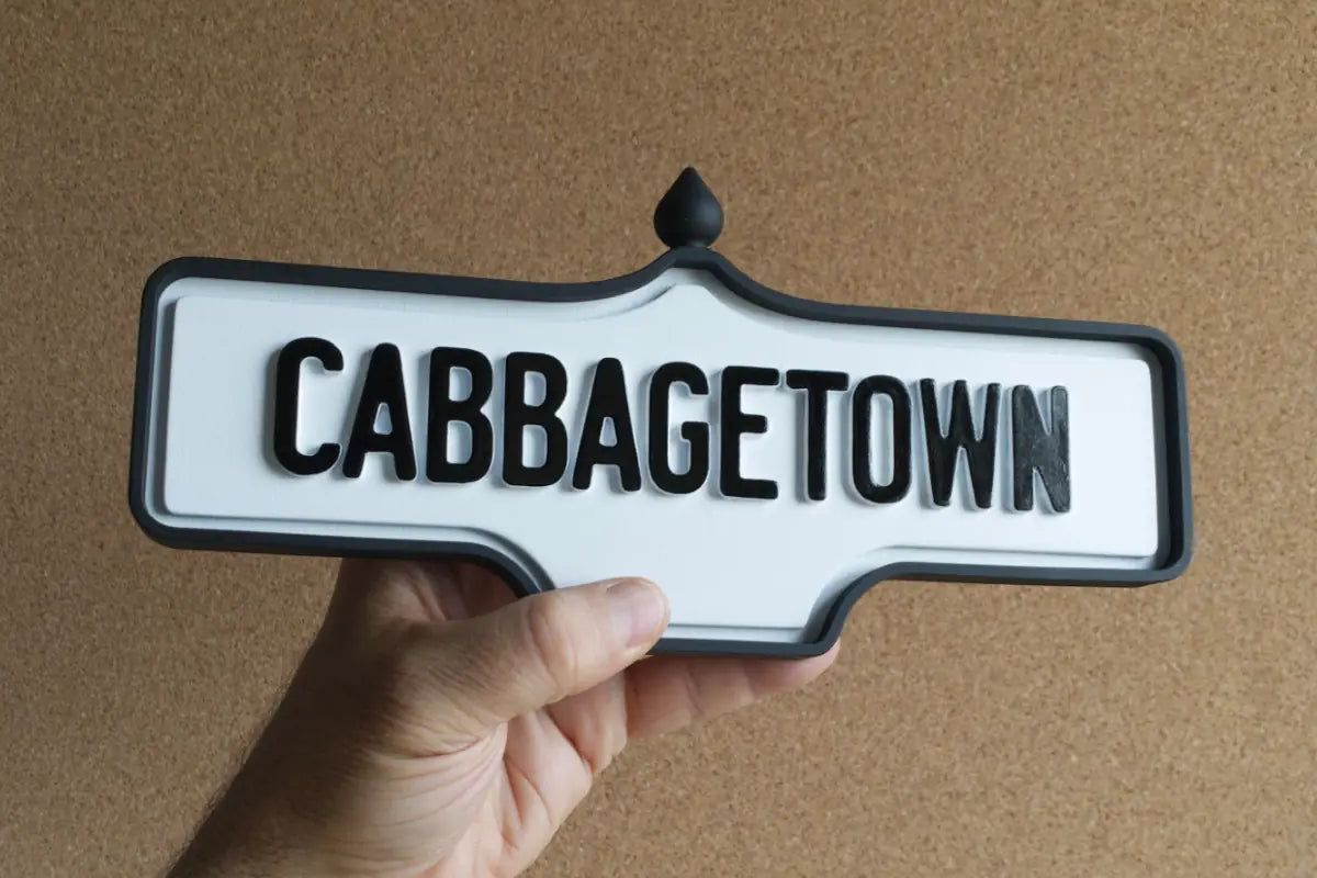 In-hand view of Cabbagetown Wall Sign - Standard Finish, wall-mounted replica Toronto acorn neighbourhood sign