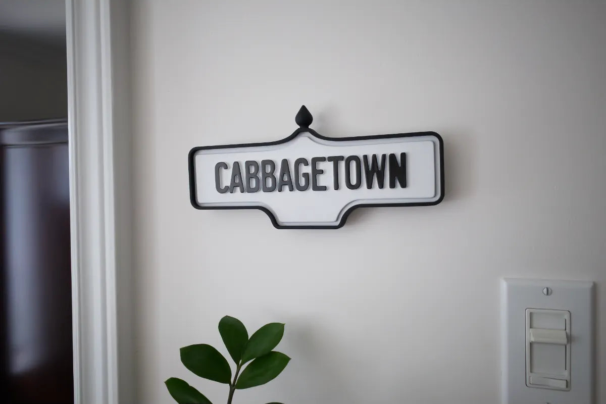 On-wall view of Cabbagetown Wall Sign - Standard Finish, wall-mounted replica Toronto acorn neighbourhood sign