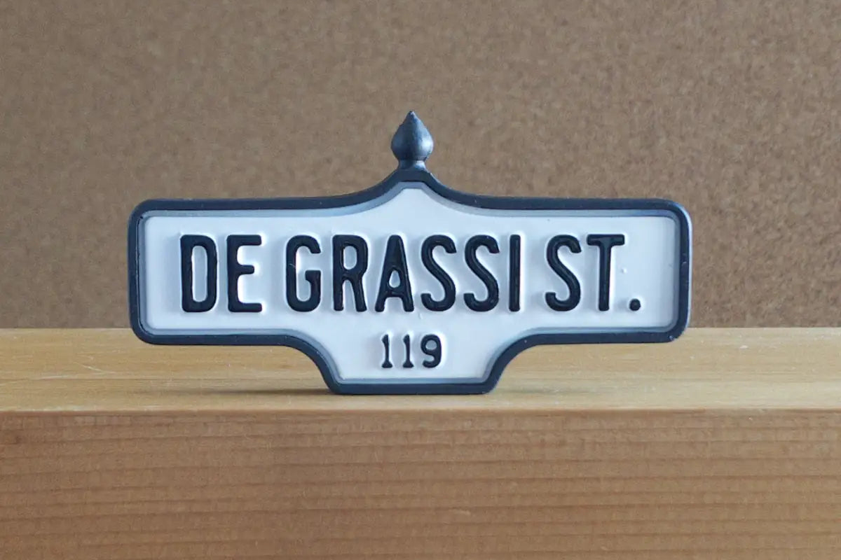 Front view of De Grassi St. #119 Pin - Standard Finish, miniature replica Toronto acorn street sign