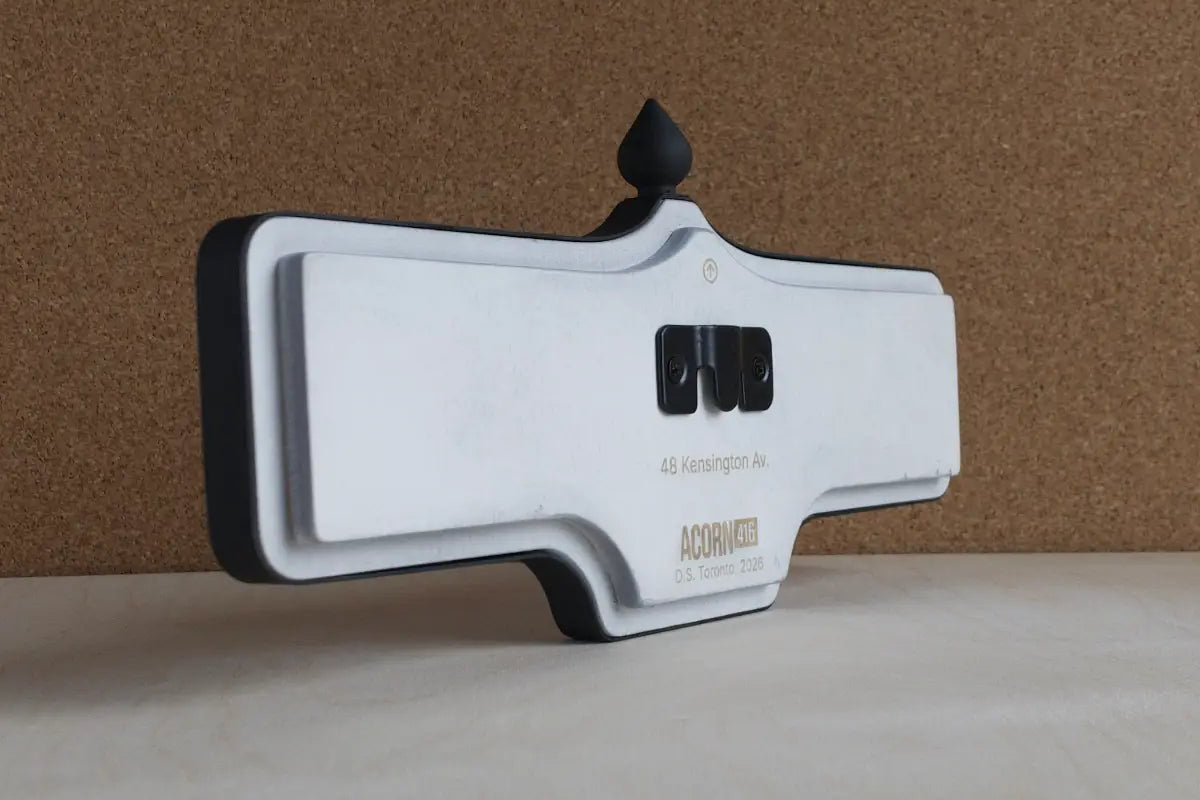 Angled back view of Kensington Av. #48 Wall Sign - Standard Finish, wall-mounted replica Toronto acorn street sign