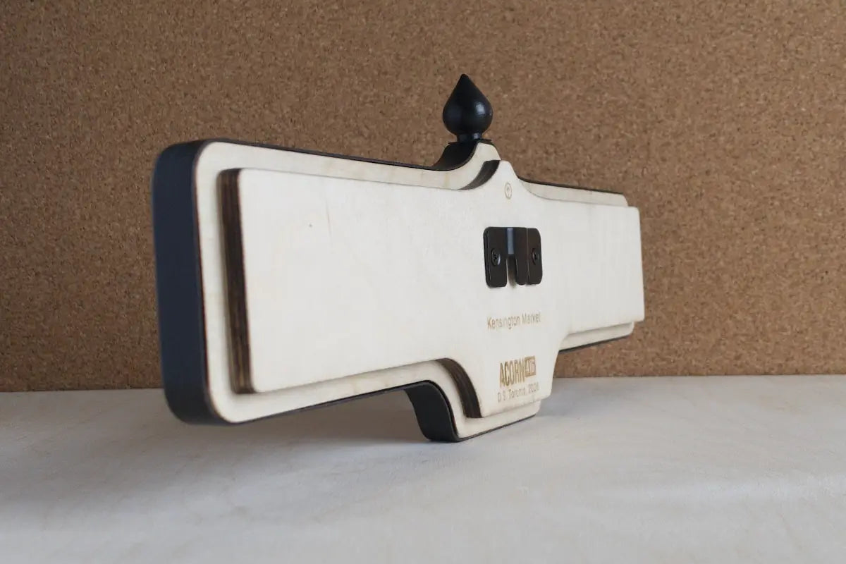 Angled back view of Kensington Market Wall Sign - Natural Finish, wall-mounted replica Toronto acorn neighbourhood sign