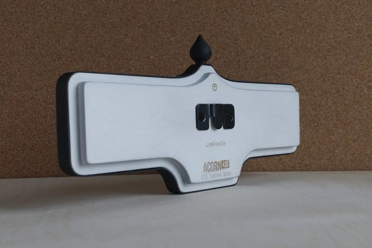 Angled back view of Leslieville Wall Sign - Standard Finish, wall-mounted replica Toronto acorn neighbourhood sign