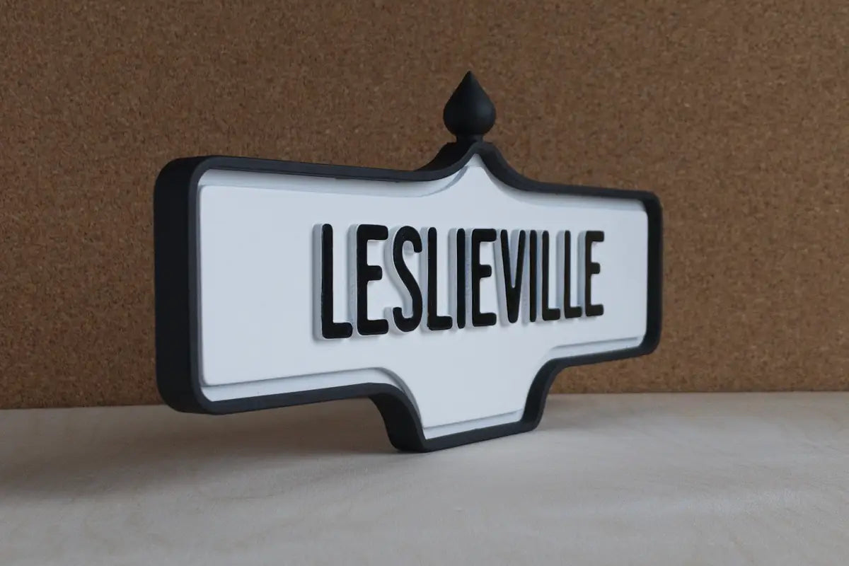 Angled front view of Leslieville Wall Sign - Standard Finish, wall-mounted replica Toronto acorn neighbourhood sign