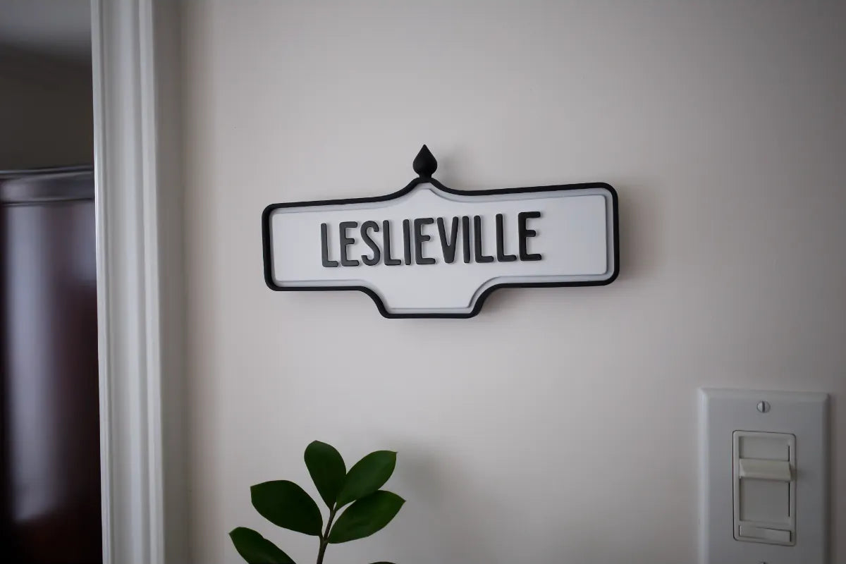 On-wall view of Leslieville Wall Sign - Standard Finish, wall-mounted replica Toronto acorn neighbourhood sign