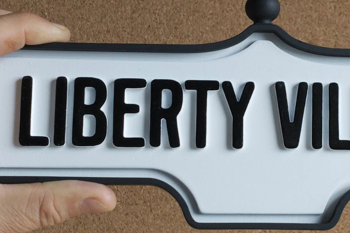 In-hand view of Liberty Village Wall Sign - Standard Finish, wall-mounted replica Toronto acorn neighbourhood sign