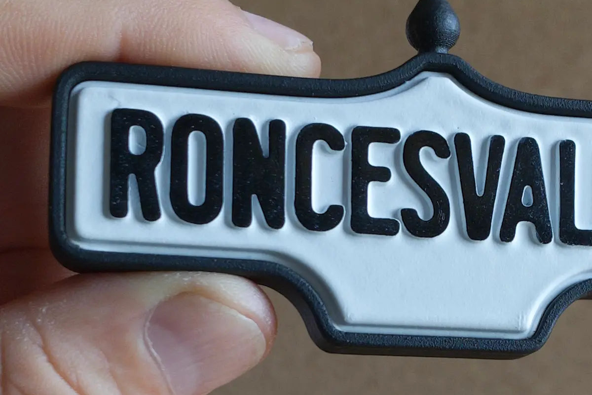 In-hand view of Roncesvalles 2-Pack - Standard Finish, miniature replica Toronto neighbourhood acorn street sign
