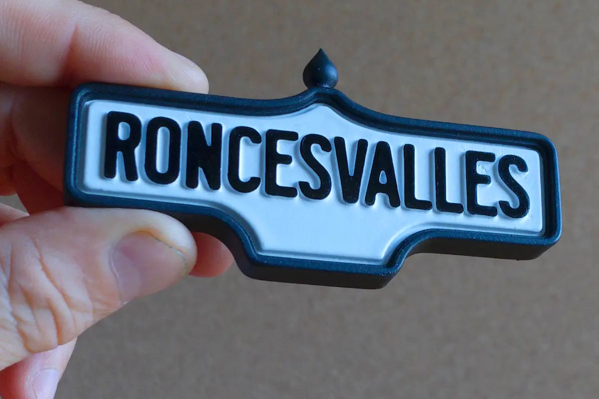 In-hand magnet front view of Roncesvalles 2-Pack - Standard Finish, miniature replica Toronto neighbourhood acorn street sign