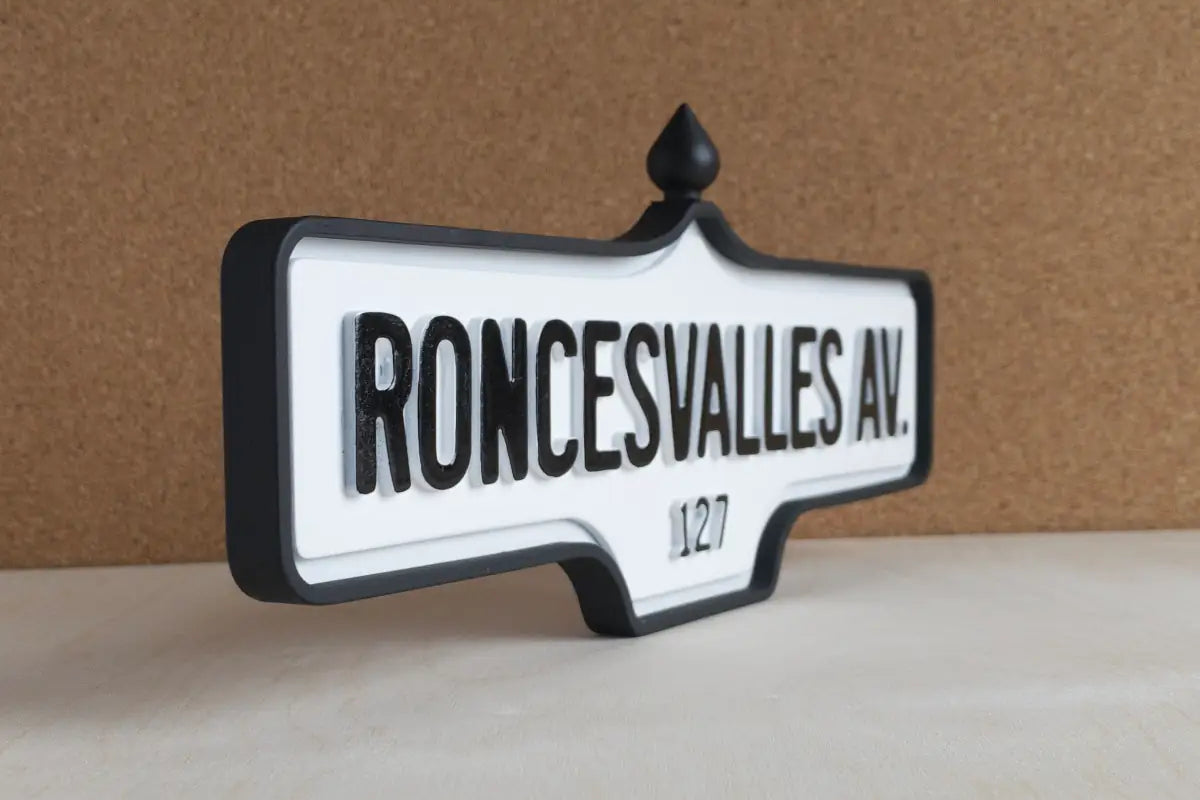 Angled front view of Roncesvalles Av. #127 Wall Sign - Standard Finish, wall-mounted replica Toronto acorn street sign
