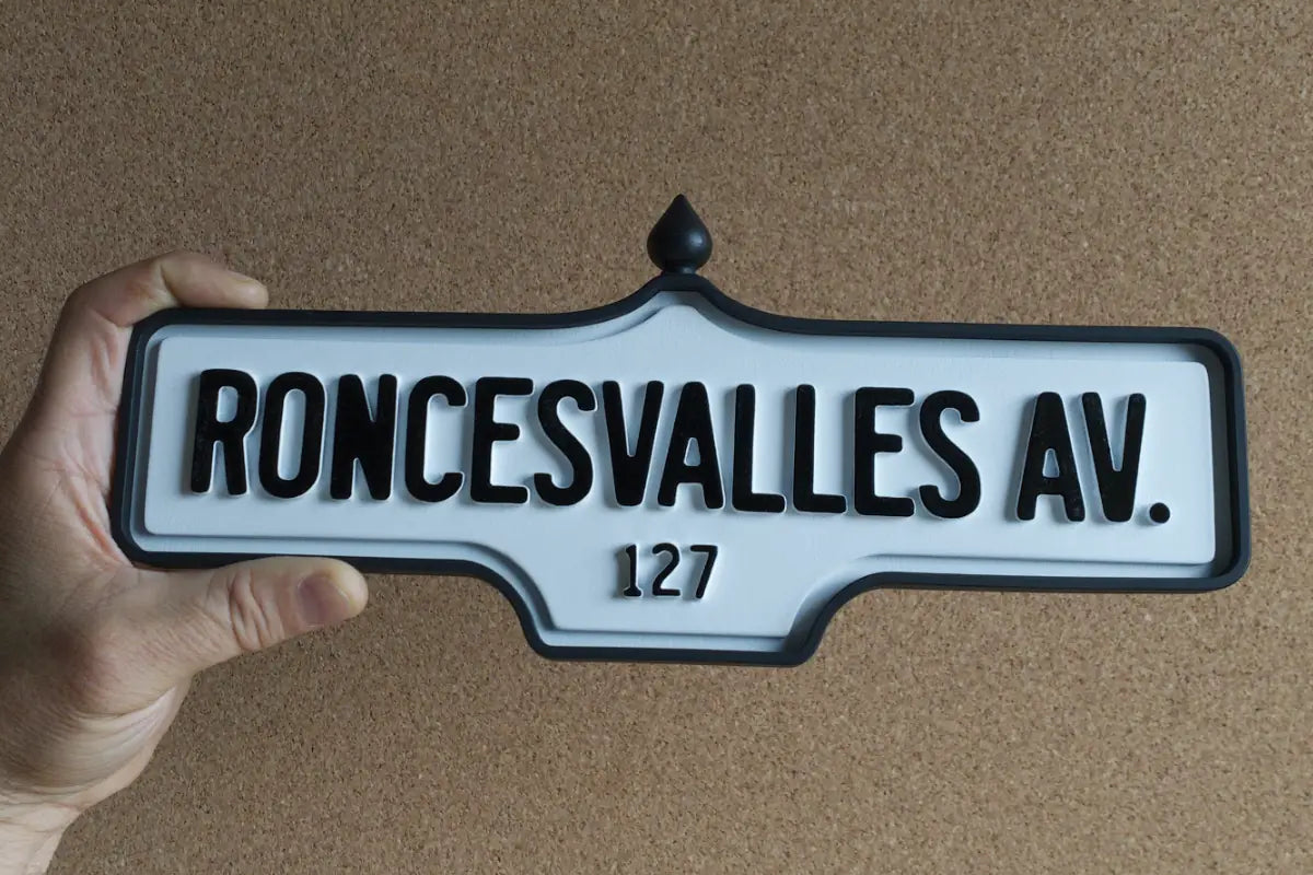 In-hand view of Roncesvalles Av. #127 Wall Sign - Standard Finish, wall-mounted replica Toronto acorn street sign