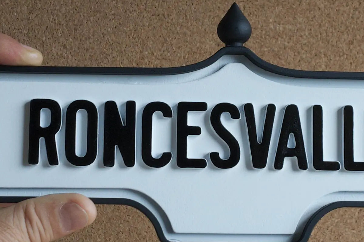 In-hand view of Roncesvalles Wall Sign - Standard Finish, wall-mounted replica Toronto acorn neighbourhood sign