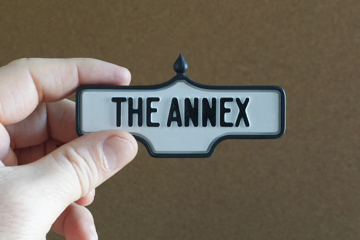 In-hand view of The Annex - Standard Finish I, miniature replica Toronto neighbourhood acorn street sign