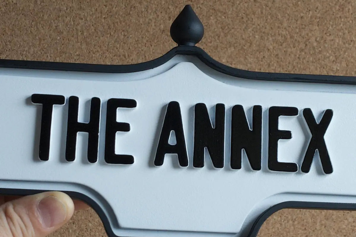 In-hand view of The Annex Wall Sign - Standard Finish, wall-mounted replica Toronto acorn neighbourhood sign
