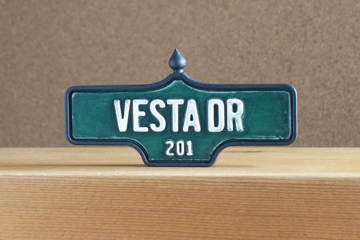 Front view of Vesta Dr #201 Magnet - Weathered Finish, miniature replica Toronto Forest Hill acorn street sign