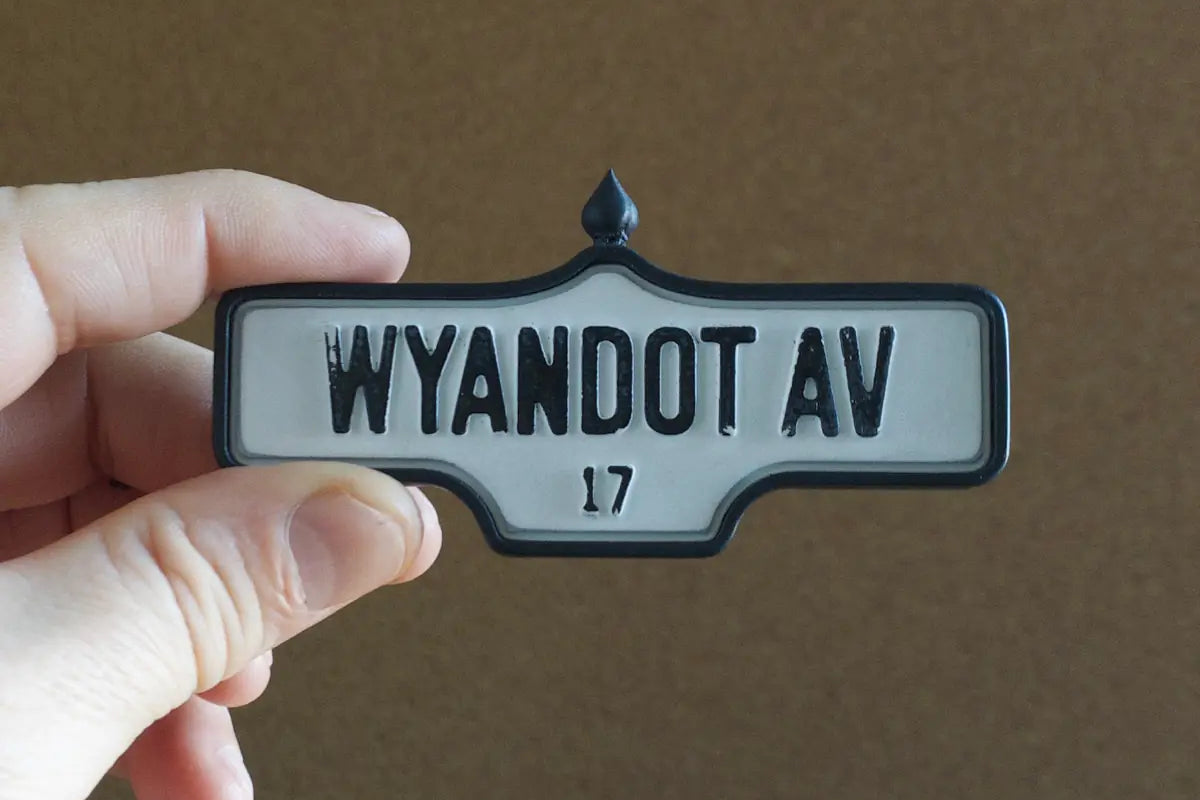 In-hand view of Wyandot Av. # 17 - Weathered Finish, miniature replica Toronto acorn street sign