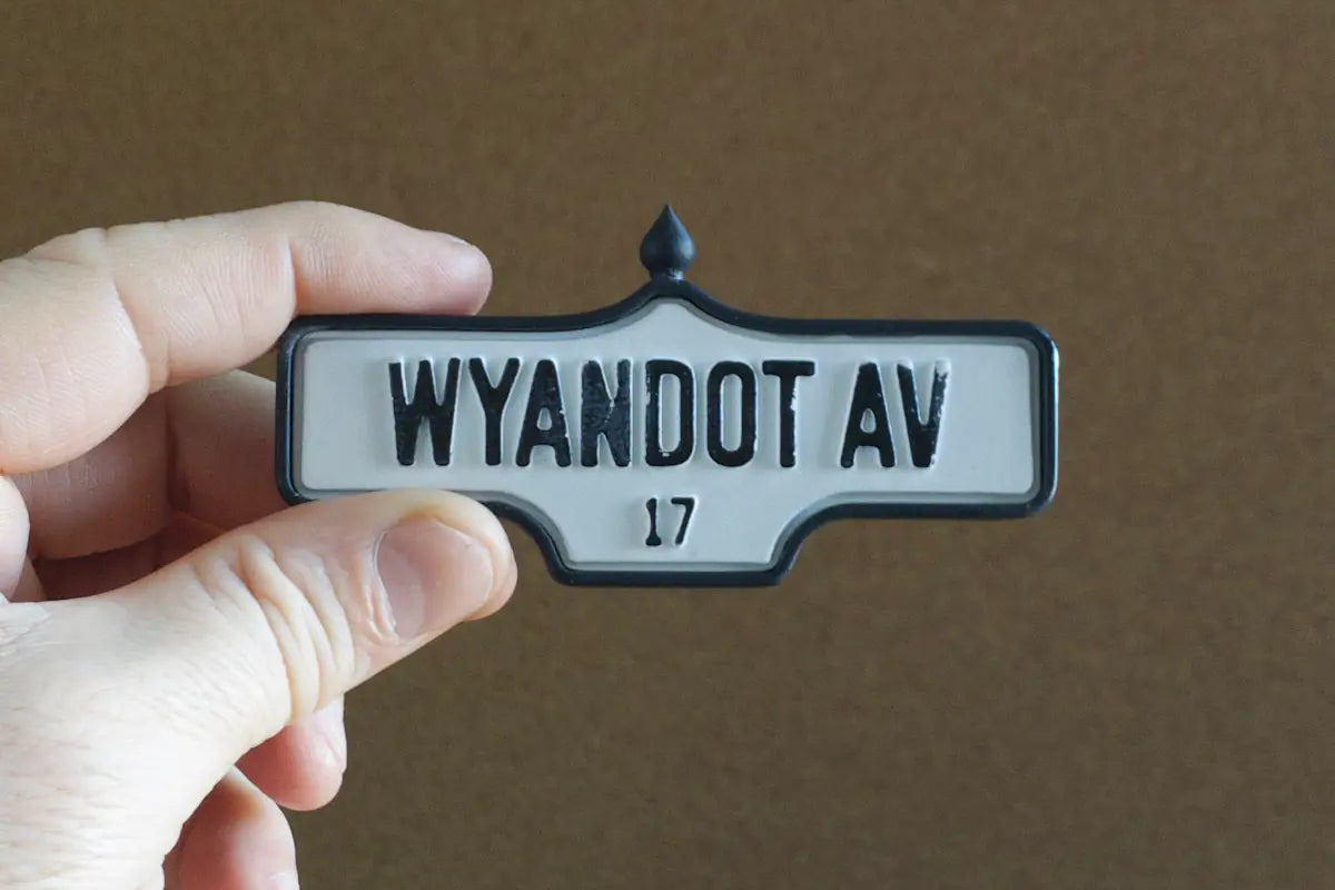 In-hand view of Wyandot Av. # 17 - Weathered Finish, miniature replica Toronto acorn street sign