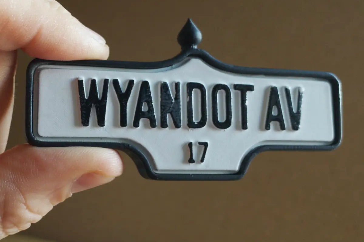 In-hand view of Wyandot Av. # 17 - Weathered Finish, miniature replica Toronto acorn street sign
